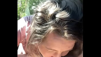 Thick hooker gives a blowjob in public then lets a guy cum all over her face