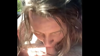 Thick hooker gives a blowjob in public then lets a guy cum all over her face