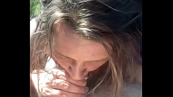 Thick hooker gives a blowjob in public then lets a guy cum all over her face