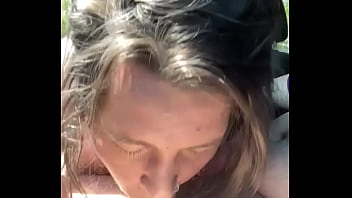 Thick hooker gives a blowjob in public then lets a guy cum all over her face