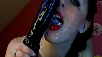 Hot dirty brunette gags and deepthroat on a huge dildo on cam