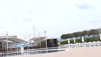 Flexible miss in a black latex catsuit