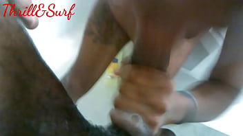 Sucking his dick in the tub