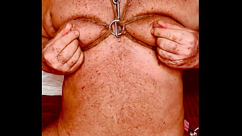 Seniormasochist pulls nipple clamps off