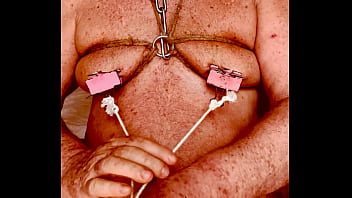 Seniormasochist pulls nipple clamps off