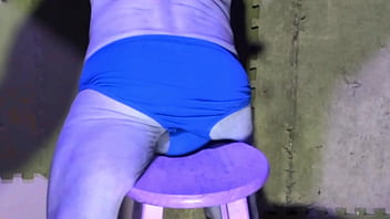 Preview stretching in basement on stool in briefs color changing