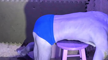 Preview stretching in basement on stool in briefs color changing