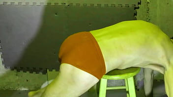 Preview stretching in basement on stool in briefs color changing