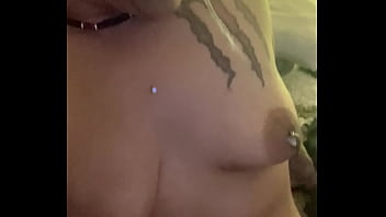 What is she doing to her tits
