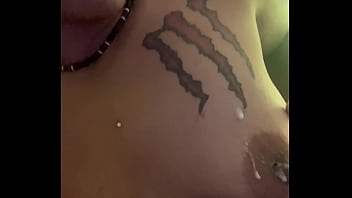 What is she doing to her tits