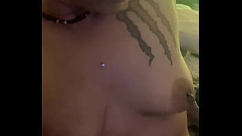 What is she doing to her tits