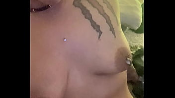 What is she doing to her tits