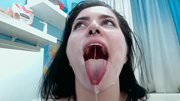 Brunette is playing with white lotion all over her body