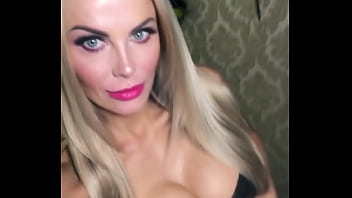 Pornstar showing off her tits in a tight corsette