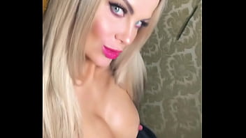 Pornstar showing off her tits in a tight corsette