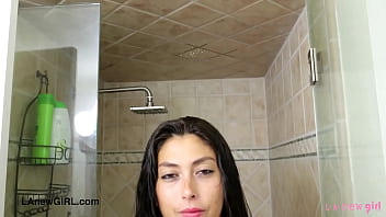 Alluring brunette model enjoys a sensual bath