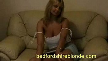 Milf with big breasts teasing at home