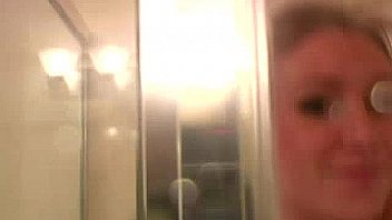 Busty blonde masturbates in the shower