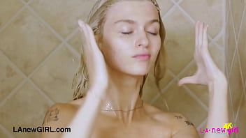 Elegant blonde enjoys a sensual bath