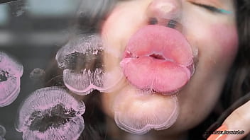 Sensual creamy pink lipgloss kiss