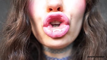 Sensual creamy pink lipgloss kiss