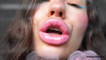 Sensual creamy pink lipgloss kiss