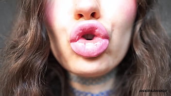 Sensual creamy pink lipgloss kiss