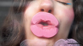 Sensual creamy pink lipgloss kiss