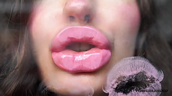 Sensual creamy pink lipgloss kiss