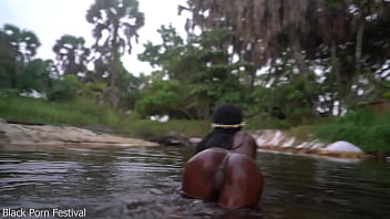 Skinny dark skinned african hottie teasing in the water