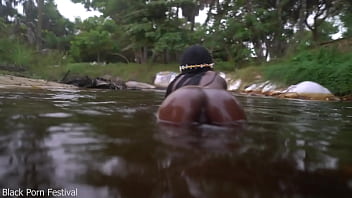Skinny dark skinned african hottie teasing in the water