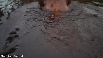 Skinny dark skinned african hottie teasing in the water