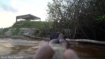Skinny dark skinned african hottie teasing in the water