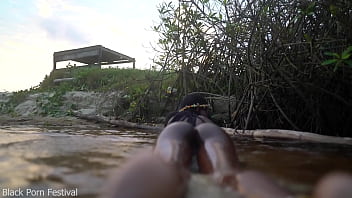 Skinny dark skinned african hottie teasing in the water