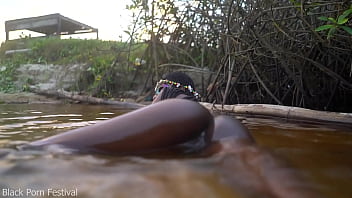 Skinny dark skinned african hottie teasing in the water