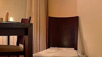 Busty brunette shows her tits on the chair