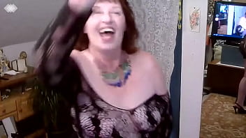 369 redhaired mature is imagining herself as a fashion model walking back and forth and shaking that keister