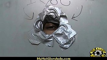 Ebony hottie milking cocks in the gloryhole 1