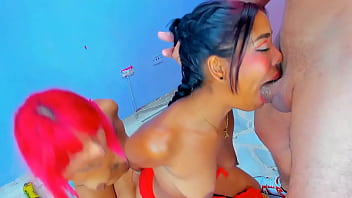 2 girls with their hands behind them swallow a big cock