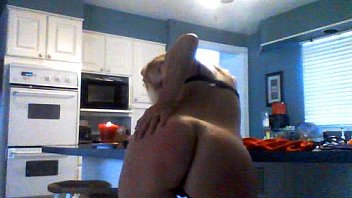 Horny milf plays in the kitchen
