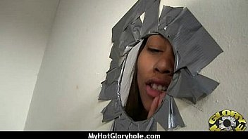 Ebony sucks off a big cock through a gloryhole 15