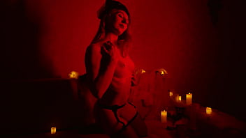 Naked beautiful witch between firing candles Naked beautiful witch between firing candles