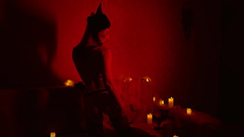 Naked beautiful witch between firing candles