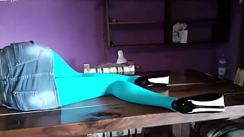 Milf with beautiful legs in pantyhose and heels lying on the table