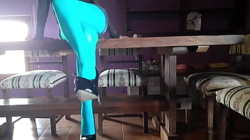 Milf with beautiful legs in pantyhose and heels lying on the table