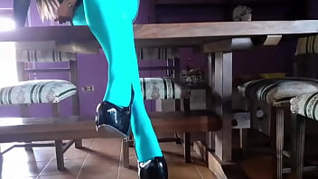 Milf with beautiful legs in pantyhose and heels lying on the table