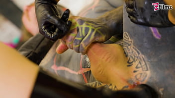 Two dominatrix fist slaves ass and finger his cock