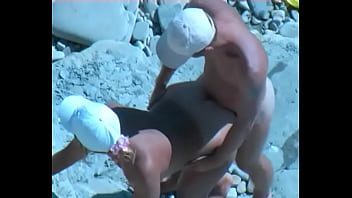 Amateur tan milf fucking on the rocks