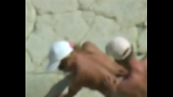 Amateur tan milf fucking on the rocks