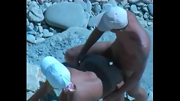 Amateur tan milf fucking on the rocks